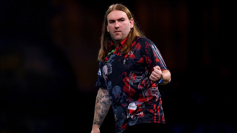 Ryan Searle celebrates defeating Tomoya Goto on day nine of the Paddy Power World Darts Championship at Alexandra Palace, London. Picture date: Saturday December 23, 2023.
