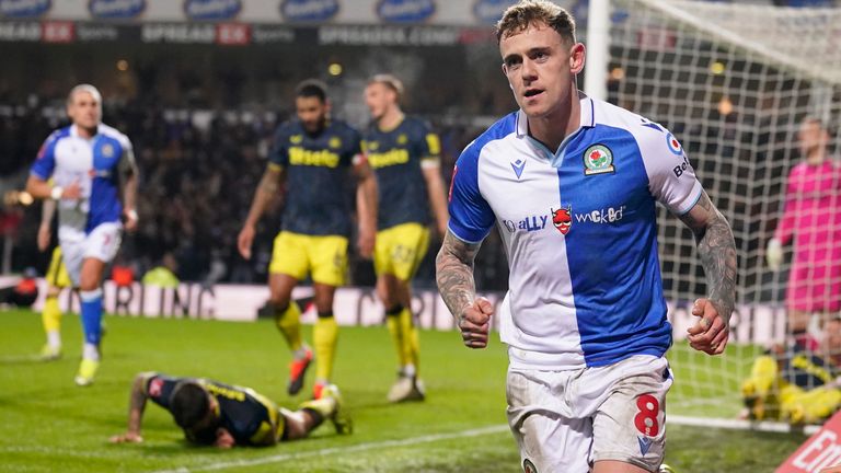 Blackburn's Sammie Szmodics, right, celebrates after scoring his side's opening goal during the English FA Cup fifth round soccer match between Blackburn Rovers and Newcastle, at Ewood Park stadium, in Blackburn, Tuesday, Feb. 27, 2024. (AP Photo/Dave Thompson)