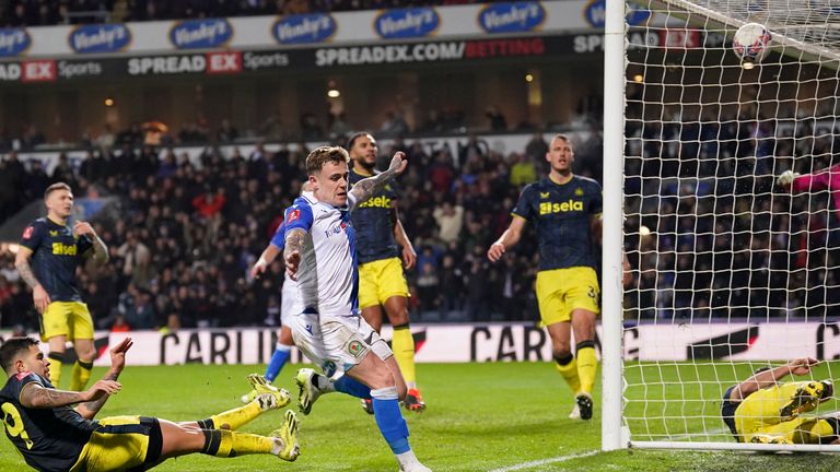 Blackburn's Sammie Szmodics, center, celebrates after scoring his side's opening goal during the English FA Cup fifth round soccer match between Blackburn Rovers and Newcastle, at Ewood Park stadium, in Blackburn, Tuesday, Feb. 27, 2024. (AP Photo/Dave Thompson)
