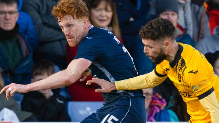 DINGWALL, SCOTLAND - FEBRUARY 24: Ross County's Simon Murray and Livingston's Jamie Brandon in action during a cinch Premiership match between Ross County and Livingston at the Global Energy Stadium, on February 24, 2024, in Dingwall, Scotland. (Photo by Mark Scates / SNS Group)