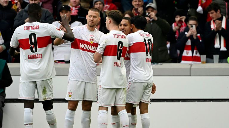 Stuttgart's Enzo Millot celebrates with his team-mates after scoring against Koln