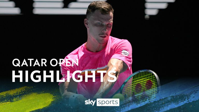Marton Fucsovics of Hungary plays a backhand return toGrigor Dimitrov of Bulgaria during their first round match at the Australian Open tennis championships at Melbourne Park, Melbourne, Australia, Tuesday, Jan. 16, 2024. (AP Photo/Louise Delmotte)


