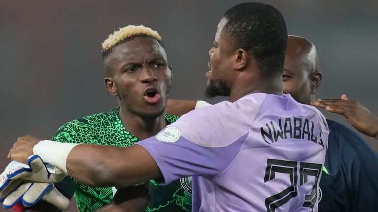 Victor Osimhen celebrates with Nigeria's goalkeeping hero Stanley Nwabili 