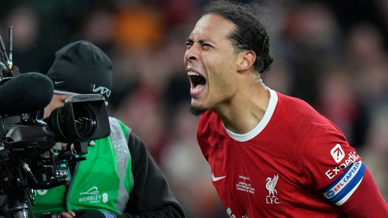 Liverpool's Virgil van Dijk roars in celebration after scoring the winning goal in the Carabao Cup final