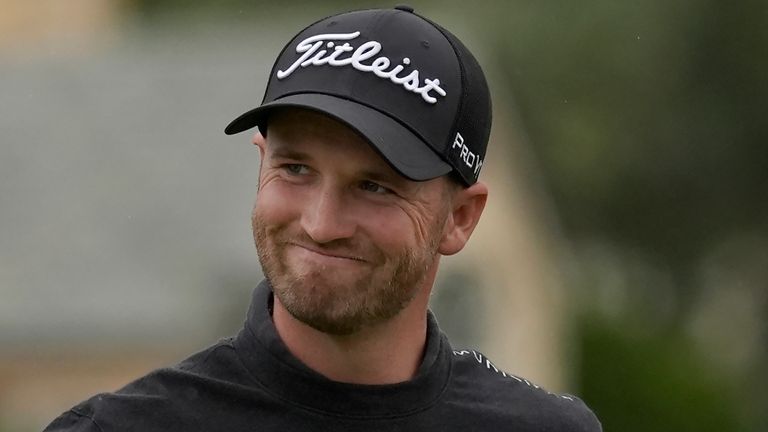 Wyndham Clark smiles while walking to the 18th green at Pebble Beach Golf Links during the third round of the AT&T Pebble Beach National Pro-Am golf tournament in Pebble Beach, Calif., Saturday, Feb. 3, 2024. (AP Photo/Ryan Sun)