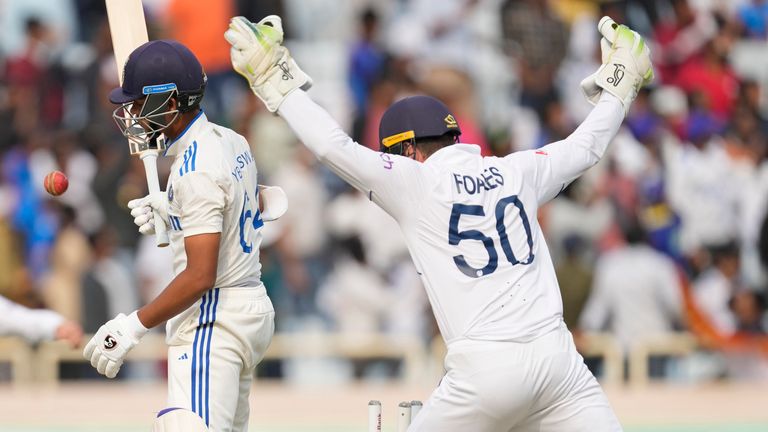 England's Ben Foakes, right, celebrates the wicket of India's Yashasvi Jaiswal, center, on the second day of the fourth cricket test match between England and India in Ranchi, India, Saturday, Feb. 24, 2024. (AP Photo/Ajit Solanki)