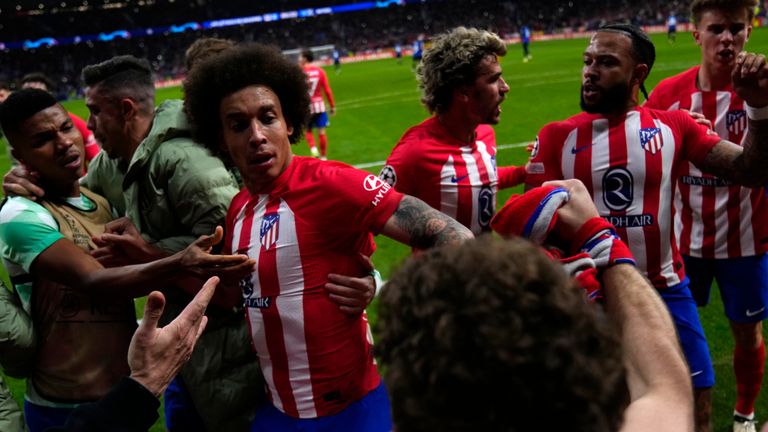 Atletico Madrid's Memphis Depay, second right, celebrates with his teammates