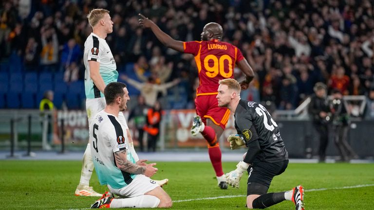 Roma's Romelu Lukaku, back, celebrates scoring his side's 2nd goal during the Europa League round of sixteen first leg soccer match between Roma and Brighton and Hove Albion, at Rome's Olympic Stadium, Thursday, March 7, 2024. (AP Photo/Andrew Medichini)