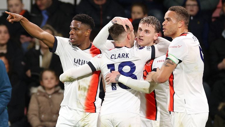 Chiedozie Ogbene celebrates scoring Luton's second goal with team-mates 