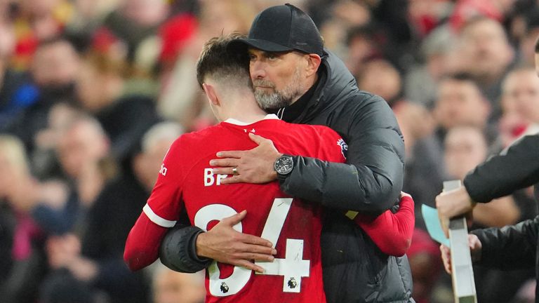 Conor Bradley is embraced by Liverpool manager Jurgen Klopp