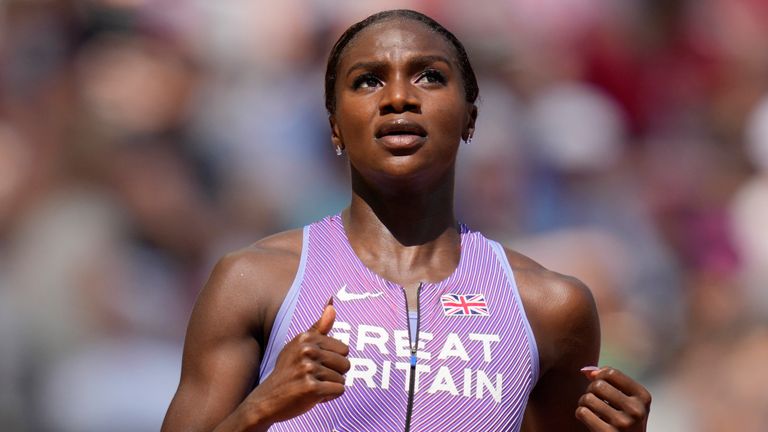 Dina Asher-Smith, of Great Britain, looks at the scoreboard after finishing the Women's 100-meters heat during the World Athletics Championships in Budapest, Hungary, Sunday, Aug. 20, 2023. (AP Photo/Ashley Landis)