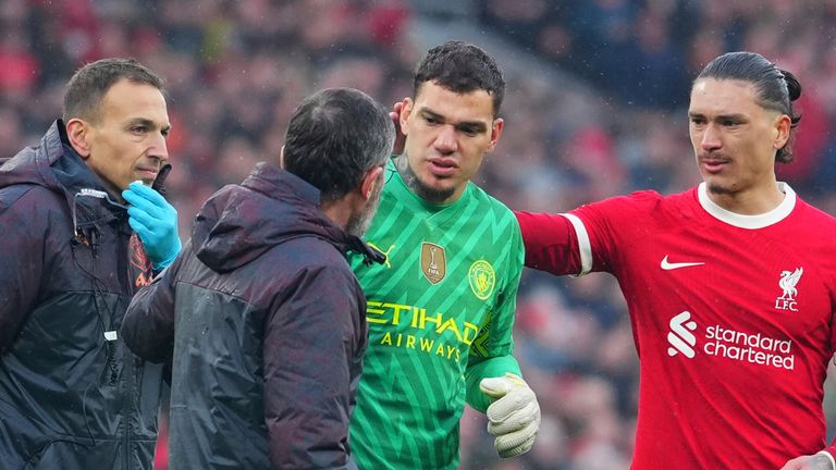Ederson leaves the pitch after suffering an injury