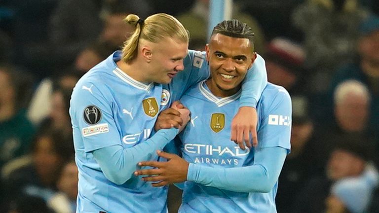 Manchester City's Manuel Akanji, right, celebrates with his teammate Erling Haaland after he scored his side's first goalduring a Champions League round of sixteen second leg soccer match between Manchester City and Copenhagen, at the Etihad Stadium in Manchester, England, Wednesday, March 6, 2024. (AP Photo/Dave Thompson)