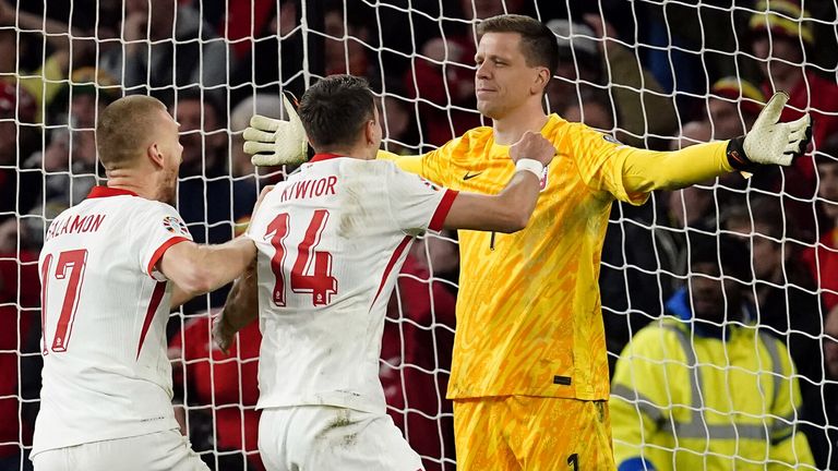 Wojciech Szczesny celebrates after saving Dan James' penalty to seal Poland's qualification for Euro 2024