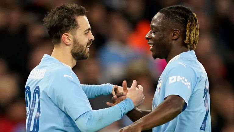 Bernardo Silva celebrates with team-mate Jeremy Doku after doubling Man City's lead against Newcastle