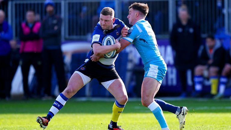 Sale Sharks' George Ford attempts to tackle Bath's Finn Russell 