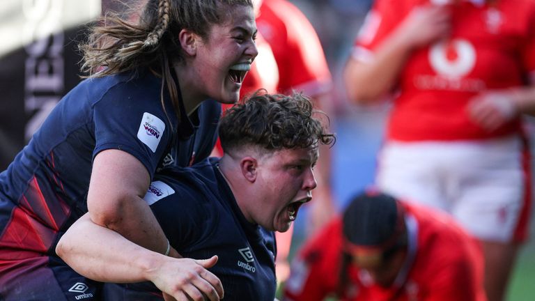 England's prop Hannah Botterman (C) celebrates after scoring a try during the Six Nations international women's rugby union match between England and Wales at Ashton Gate Stadium in Bristol, south-west England on March 30, 2024. (Photo by Adrian DENNIS / AFP)