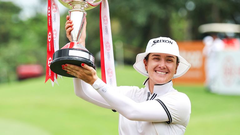 Hannah Green of Australia poses with the trophy after the third round of the HSBC Women's Wold Championship at the Sentosa Golf Clubin Singapore Sunday, March 3, 2024. (AP Photo/Danial Hakim)