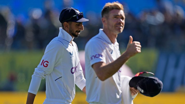 England's James Anderson gestures to the crowd as he walks with teammate Shoaib Bashir at the end of India's innings on the third day of the fifth and final test match between England and India in Dharamshala, India, Saturday, March 9, 2024. (AP Photo /Ashwini Bhatia)