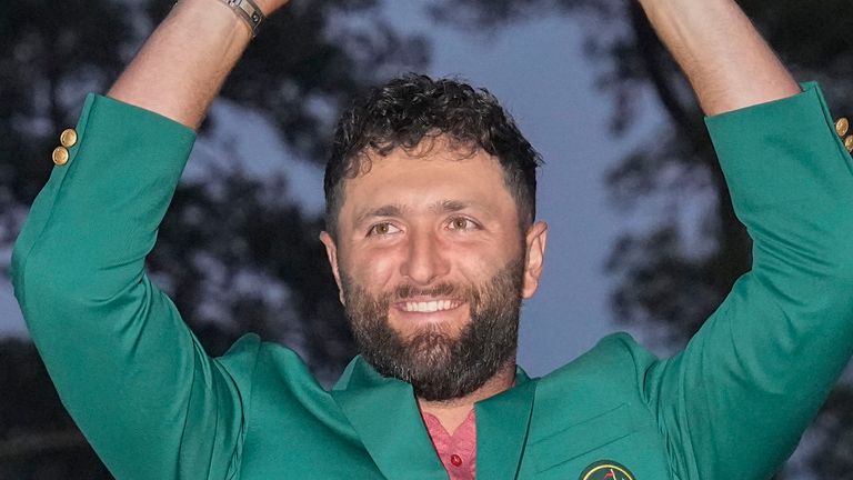 FILE -  FILE - Jon Rahm, of Spain, holds up the trophy after winning the Masters golf tournament at Augusta National Golf Club on Sunday, April 9, 2023, in Augusta, Ga. Rahm is expected to compete in the PGA Championship next week at Oak Hill Country Club in Pittsford, N.Y. Rahm has been saying that he plays golf for history and for legacy, not for money. And now he's playing for the Saudi-funded LIV Golf League in a shocking departure from the PGA Tour.(AP Photo/David J. Phillip, File)