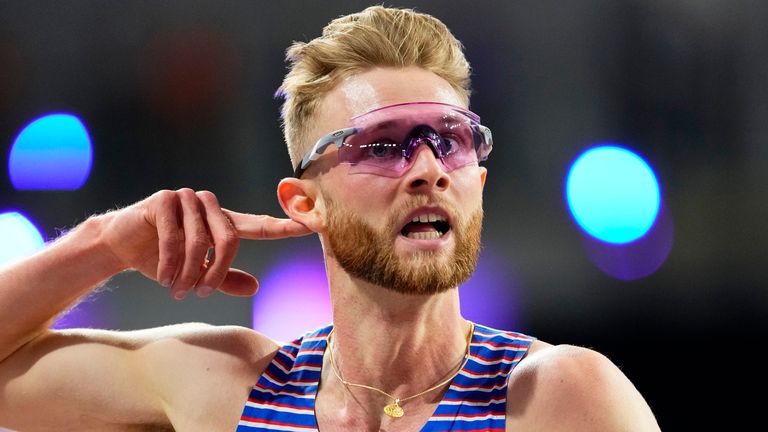 Josh Kerr, of Great Britain, reacts after winning the gold medal in the men's 3,000 meters during the World Athletics Indoor Championships at the Emirates Arena in Glasgow, Scotland, Saturday, March 2, 2024. (AP Photo/Petr David Josek)