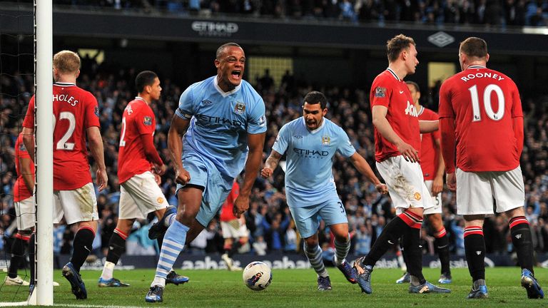 Vincent Kompany celebrates scoring his teams first goal during the Barclays Premier League match at the Etihad Stadium