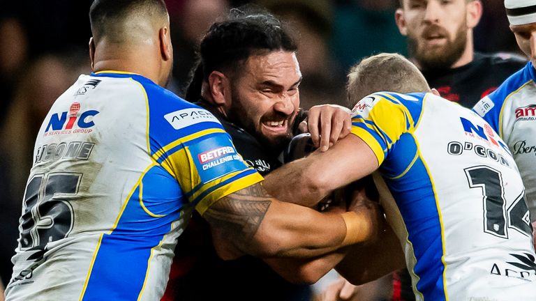 Picture by Allan McKenzie/SWpix.com - 22/03/2024 - Rugby League - Betfred Challenge Cup Round 6 - Leeds Rhinos v St Helens - AMT Headingley, Leeds, England - St Helens' Konrad Hurrell is tackled by Leeds' Sam Lisone & Jarrod O'Connor.