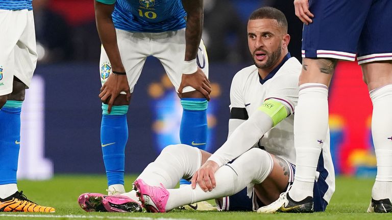 Kyle Walker waits for treatment after being injured during an international friendly against Brazil 