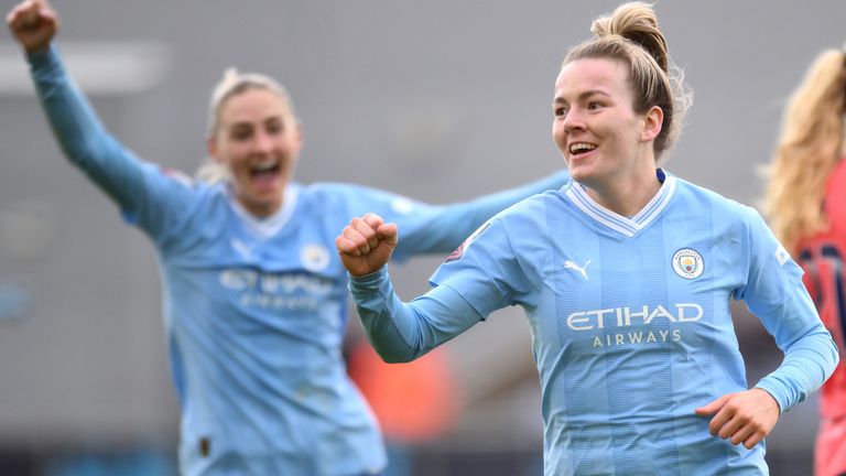 Lauren Hemp celebrates after she doubled Man City's lead over Everton