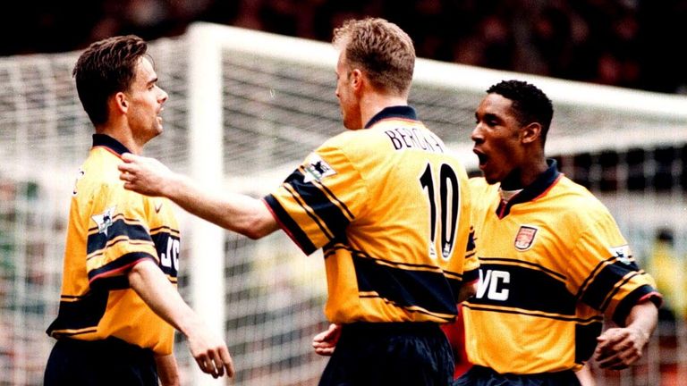 Arsenal's Marc Overmars (left) is congratulated by teammates Dennis Bergkamp (centre) and Nicolas Anelka after scoring for Arsenal during the Premiership clash against Manchester United at Old Trafford today (Saturday). The final score was 1-0 to Arsenal. Photo by Rui Vieira/PA. See PA Story SOCCER Man Utd.