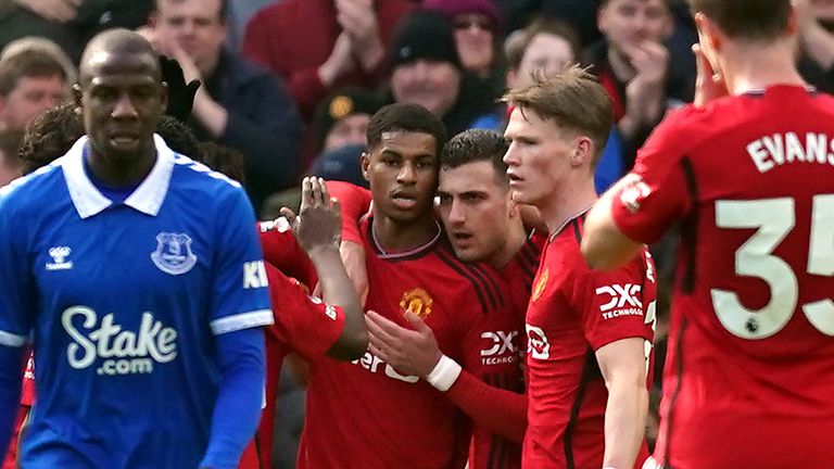 Marcus Rashford is congratulated by team-mates after scoring