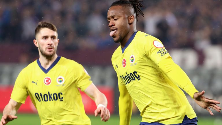 Fenerbahce's Michy Batshuayi, right, celebrates after scoring his side's third and winning goal during the Turkish Super Lig soccer match between Trabzonspor and Fenerbahce at the Senol Gunes stadium in Trabzon, Turkey, Sunday, March 17, 2024. Turkish top tier club Trabzonspor fans invaded the pitch following a home loss against Fenerbahce late Sunday, touching off violent scuffles between the fans and Fenerbahce players. (Serkan Hacioglu/Dia Images via AP)