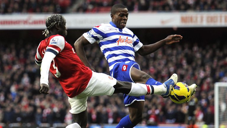 Arsenal's Bacary Sagna (left) challenges QPR's Nedum Onuoha during the Barclays Premier League match at the Emirates Stadium, London