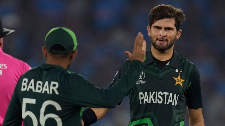 Pakistan's Shaheen Afridi is congratulated by captain Babar Azam after taking the wicket of India's captain Rohit Sharma during the ICC Men's Cricket World Cup match between India and Pakistan in Ahmedabad, India, Saturday, Oct. 14, 2023. (AP Photo/Ajit Solanki)