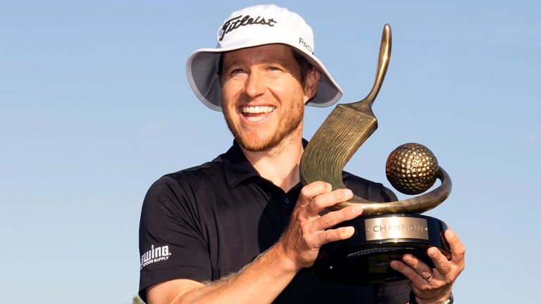 Peter Malnati holds up the trophy after winning the Valspar Championship golf tournament Sunday, March 24, 2024, at Innisbrook in Palm Harbor, Fla. (AP Photo/Chris O'Meara)