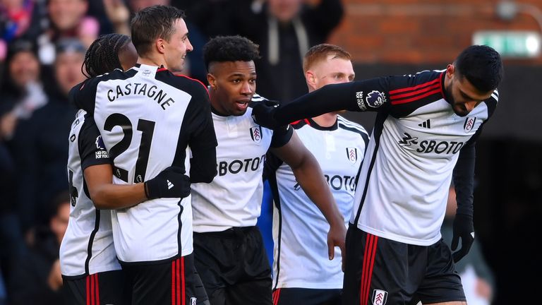 Adama Traore is congratulated after scoring Fulham's third goal against Brighton