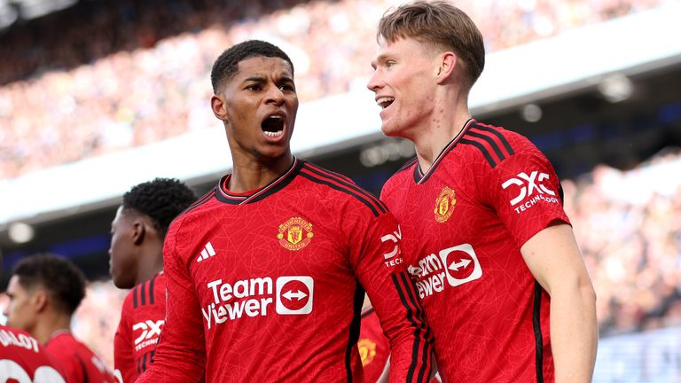 Marcus Rashford celebrates after giving Manchester United a derby lead with a stunning strike