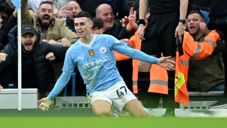 Phil Foden celebrates after scoring his second goal of the game in the Manchester derby