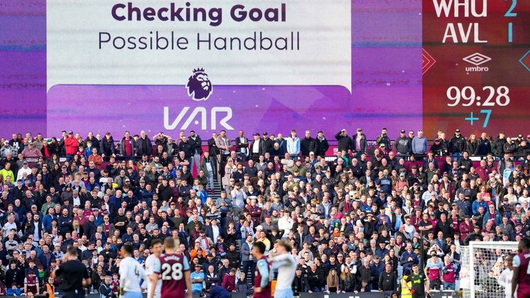 Fans and players wait for VAR to adjudicate whether a late West Ham goal should stand