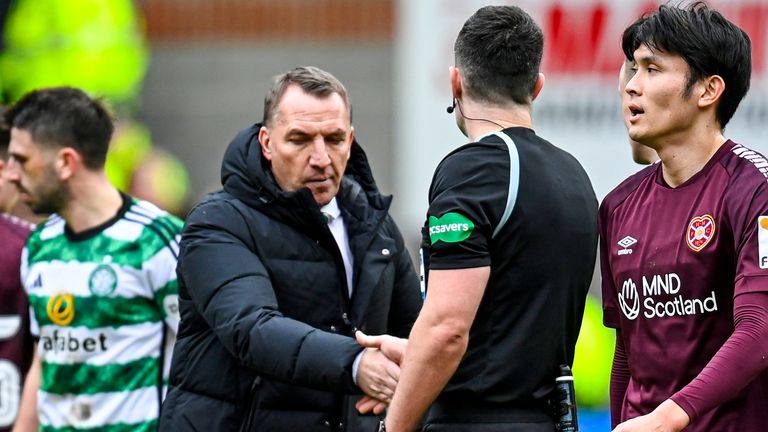 EDINBURGH, SCOTLAND - MARCH 3: Celtic manager Brendan Rodgers shakes hands with referee Don Robertson during a tense Premiership match between Heart of Midlothian and Celtic at Tynecastle Park on March 3, 2024 in Edinburgh, Scotland.  (Photo by Rob Casey / SNS Group)