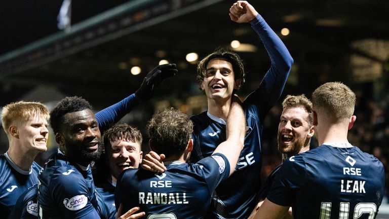 Ross County's Yan Dhanda celebrates with teammates after levelling in second-half stoppage time