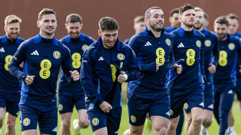 GLASGOW, SCOTLAND - MARCH 19: John McGinn leads the squad in warming up during a Scotland training session at Lesser Hampden, on March 19, 2024, in Glasgow, Scotland.  (Photo by Craig Foy / SNS Group)