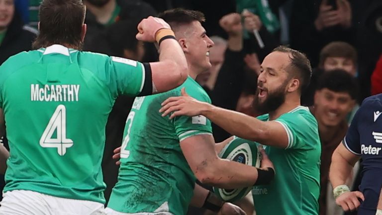 Dan Sheehan celebrates after scoring Ireland's opening try against Scotland