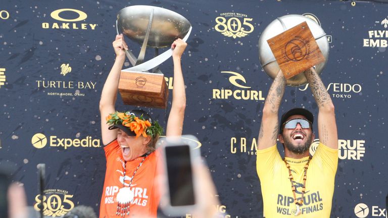 Gilmore and Felipe Toledo of Brazil celebrate with their trophies during the Rip Curl WSL Finals at Lower Trestles, San Clemente