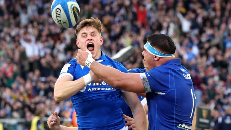 Stephen Varney of Italy celebrates scoring his team's third try with team-mate Danilo Fischetti