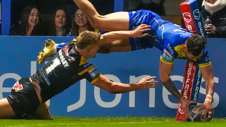 Picture by Olly Hassell/SWpix.com - 01/03/2024 - Rugby League - Betfred Super League Round 3 - Warrington Wolves v Castleford Tigers - Halliwell Jones Stadium, Warrington, England - Castleford's Luke Hooley fails to stop Warrington's Matty Ashton from scoring a try