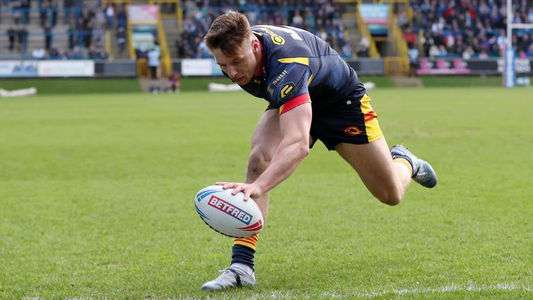 Picture by Ed Sykes/SWpix.com - 24/03/2024 - Rugby League - Betfred Challenge Cup Round 6 - Halifax Panthers v Catalans Dragons - The Shay Stadium, Halifax, England - Catalans Dragons' Tom Davies scores their second try and his second of the game