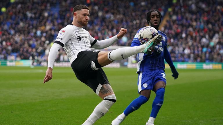 Ipswich Town's Wes Burns clears the ball under pressure from Josh Wilson-Esbrand