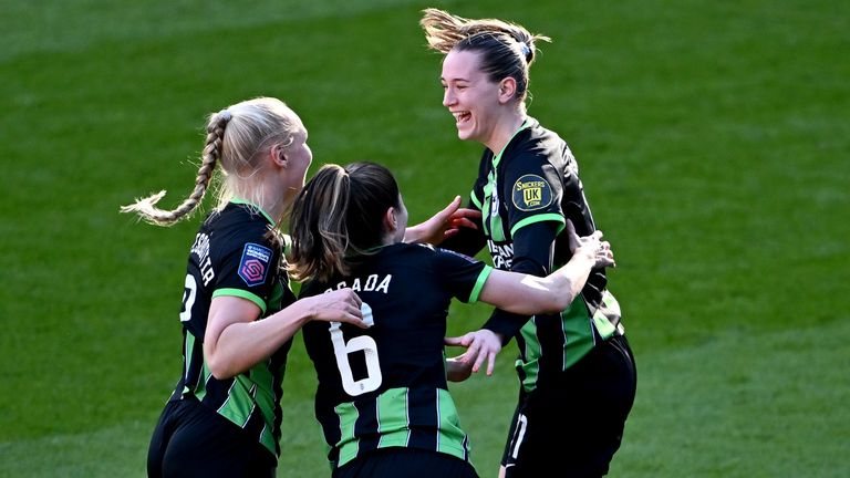 Elisabeth Terland celebrates with her team-mates after finding the net for Brighton against Bristol City