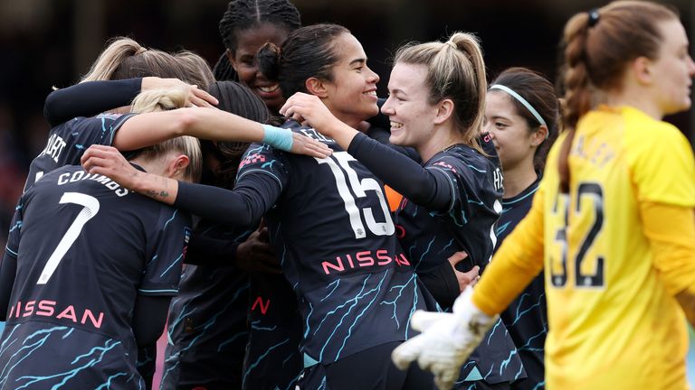 Mary Fowler celebrates with her team-mates after doubling Man City's lead at Brighton